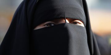 Hind Ahmas wears a niqab, despite a nationwide ban on the Islamic face veil, outside the courts in Meaux
