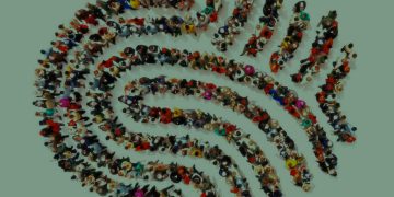 Large group pf people in the shape of a fingerprint on an isolated white background. People finding there identity, identity theft, individuality concept.